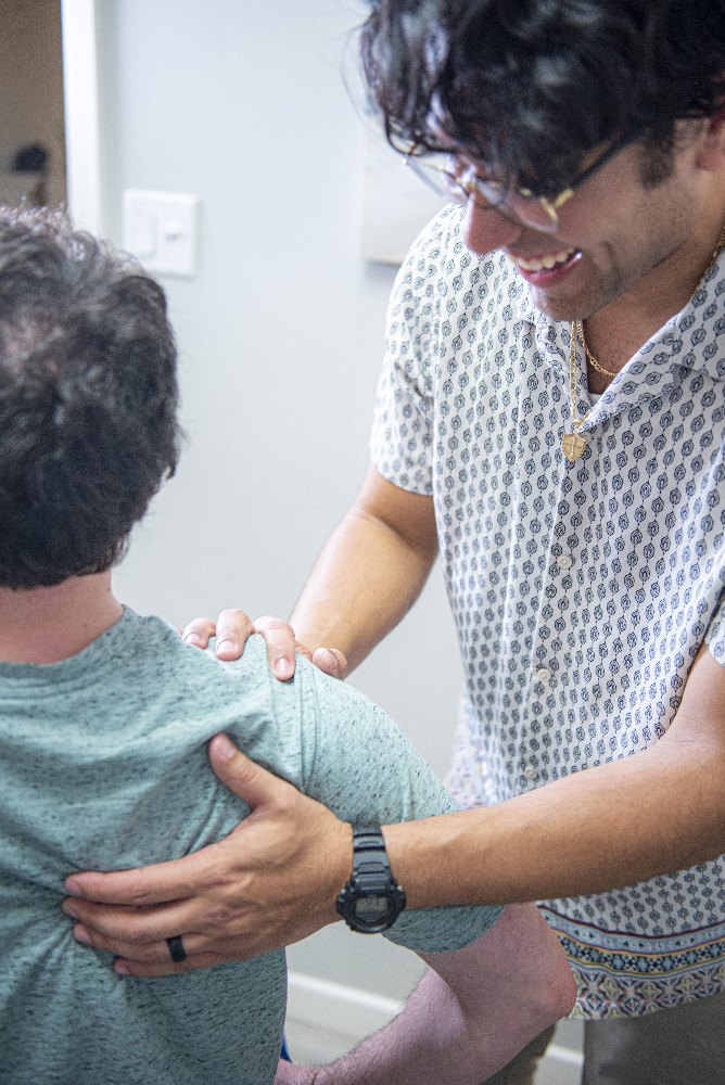 dr. julian dalton helping a patient with herniated disc issues