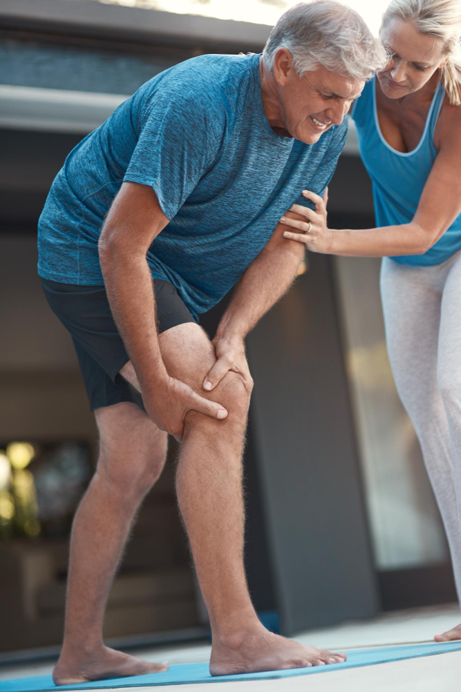 mature man grabbing his knees due to joint inflammation