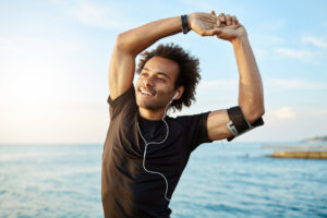 man stretching during his exercise outide showcasing a health spine from chiropractic care