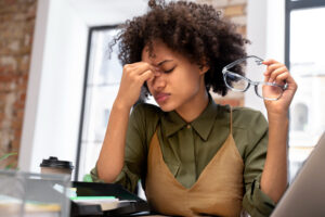 woman stressed at job and needs chiropractic care and need help managing stress