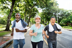 active seniors power walking outside, realtined to chiropractic care for seniors article